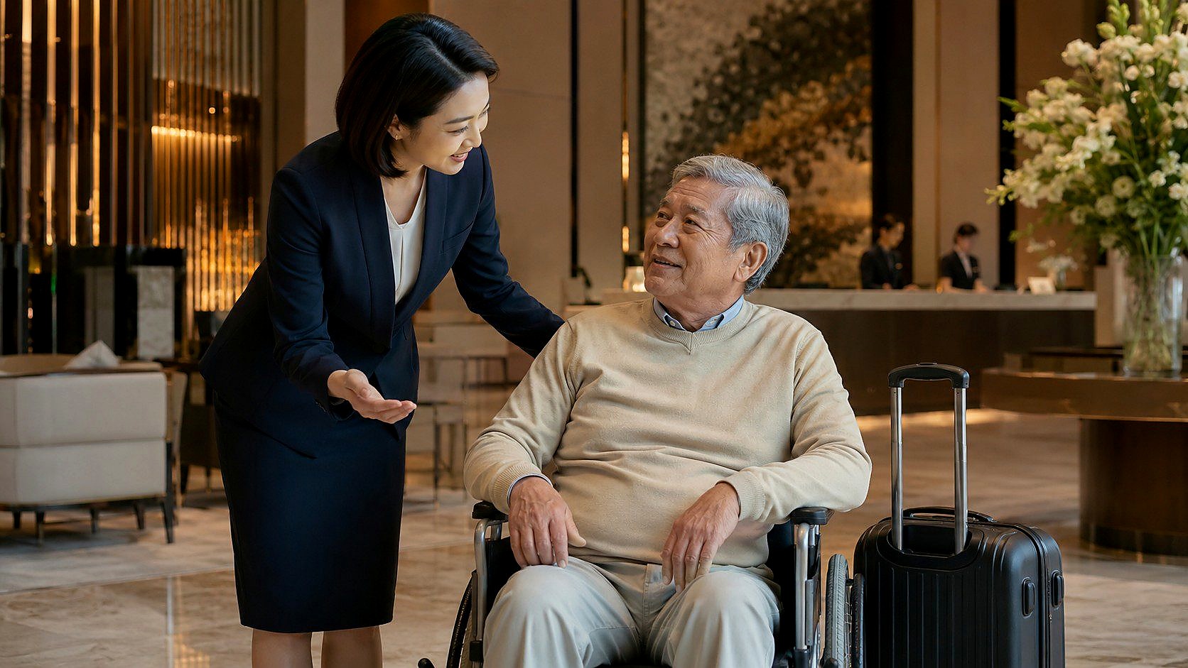 A coordinator assisting a healthcare traveller in a hotel lobby